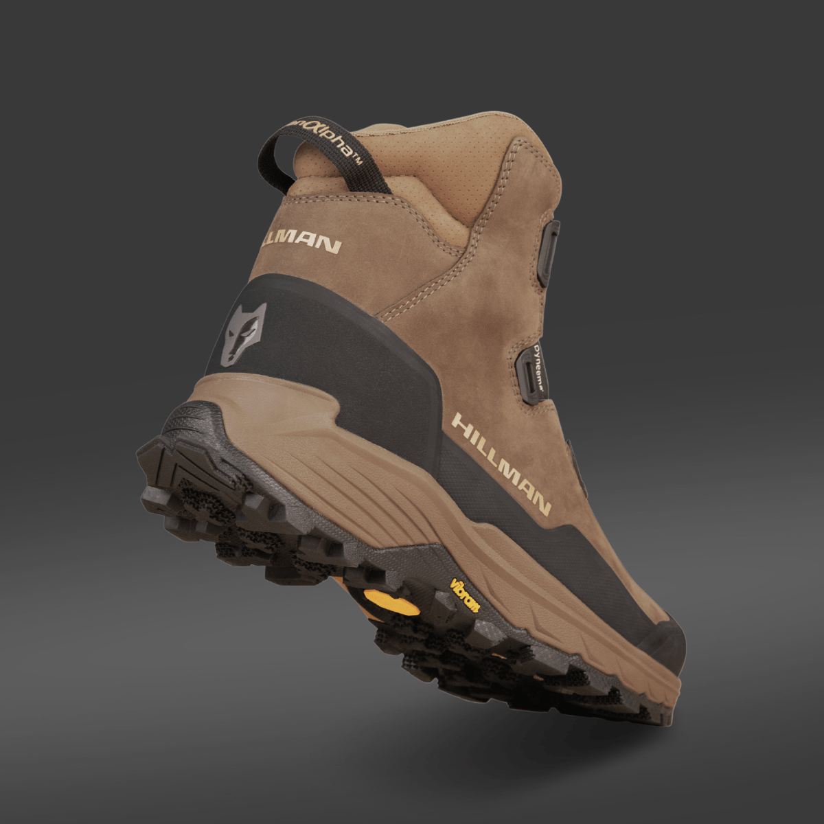 A brown and black HILLMAN PRE-ORDER DRYHUNT 2.0 Waterproof Hunting Boot with rugged tread, HILLMAN branding on the side and heel, is displayed on a dark gradient background, elevating its sole and reinforced heel for performance-focused hunters.