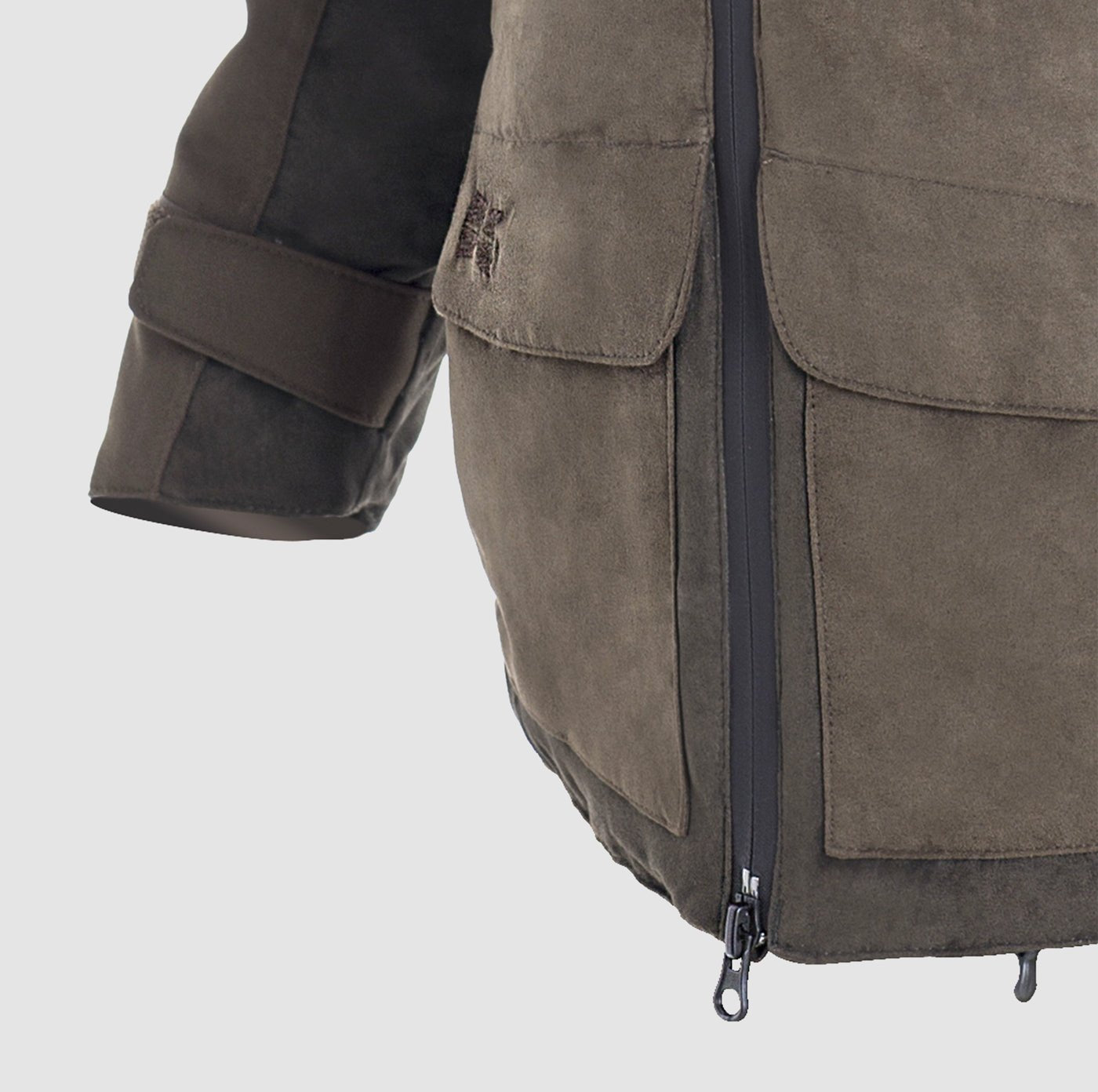 Close-up of the Hillman® PRE ORDER Fusion Hunting Jacket in brown suede Cordura, featuring a visible zipper, large front pocket, and adjustable sleeve strap against a light gray background.