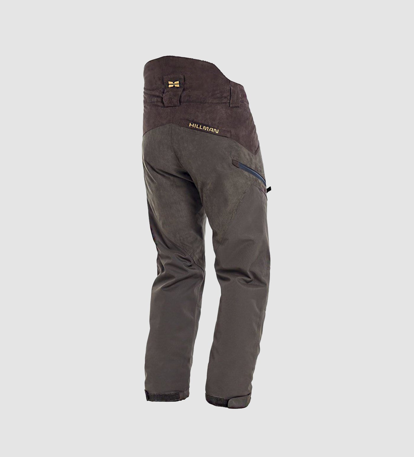 PRE ORDER Fusion Waterproof Hunting Trousers by Hillman® in dark green and brown, featuring reinforced seat and knees, zippered side pocket, and Hillman® logo on the back waistband, displayed on a light gray background.
