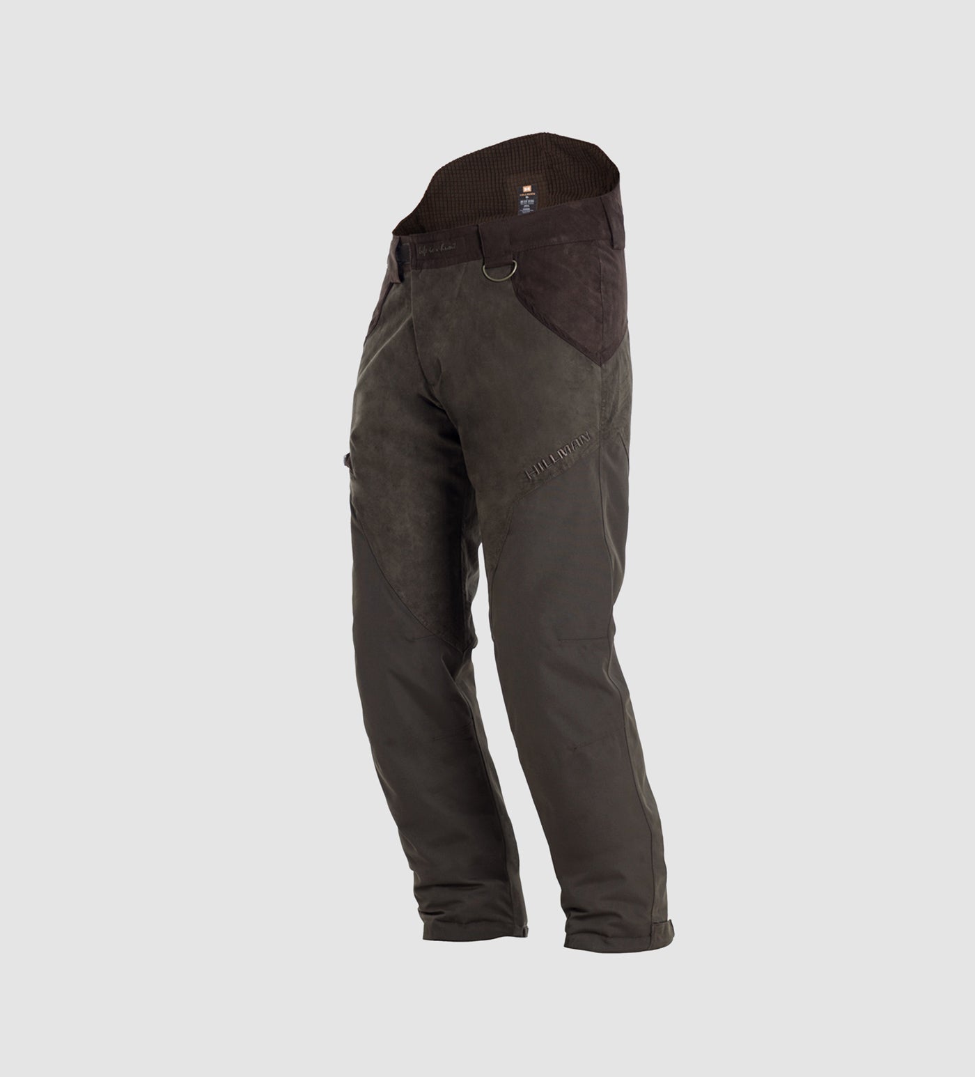 The Hillman® PRE ORDER Fusion Waterproof Hunting Trousers in dark green feature reinforced knees and thighs, angled side pockets, and a high waistband for comfort, shown on a light gray background.