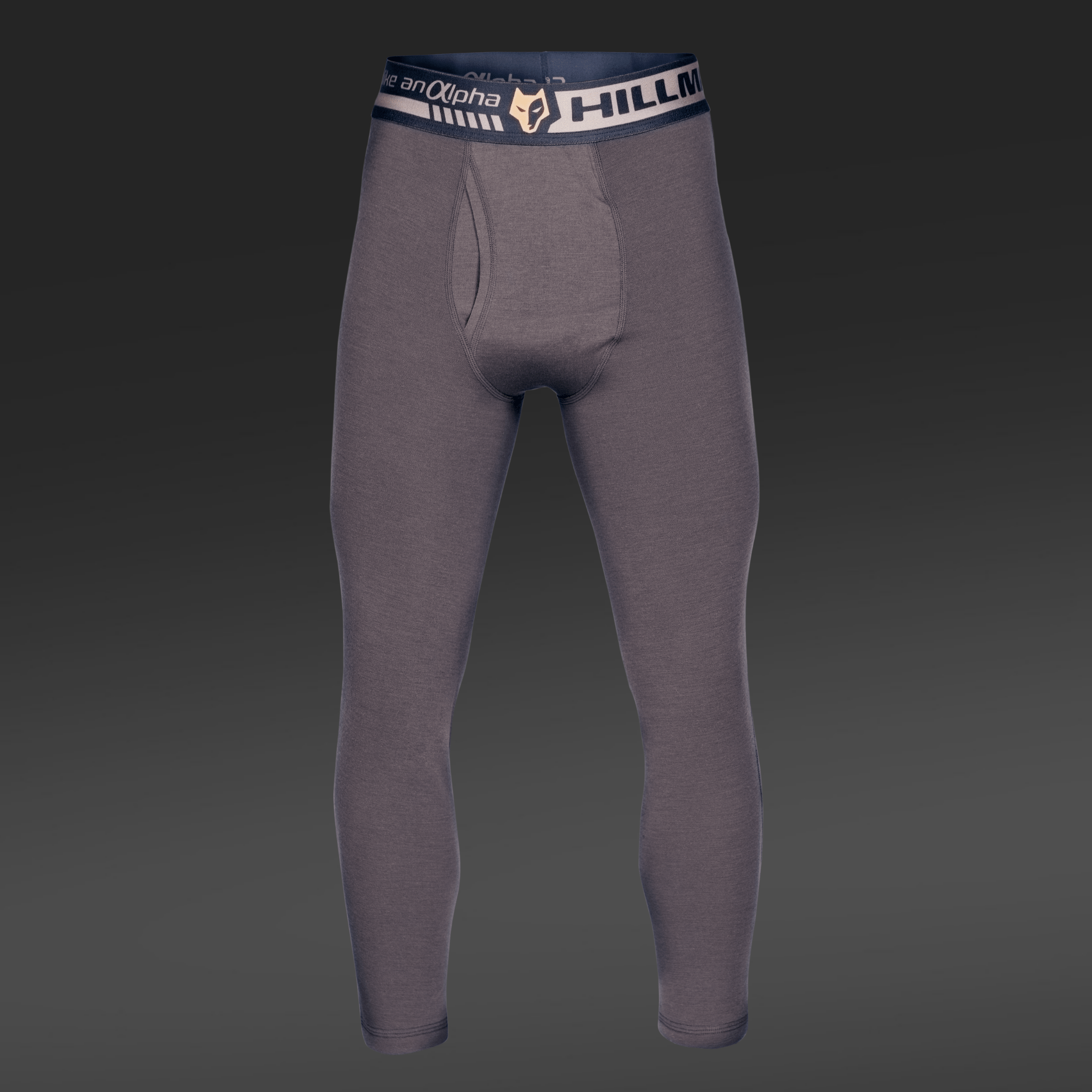 Gray 2BL Thermal Base Layer Trousers by Hillman®GWR, made from merino wool with HILLMAX alpha on the dark waistband and a logo. Displayed against a dark background, these long johns demonstrate their full length and snug fit, perfect as a thermal base layer.