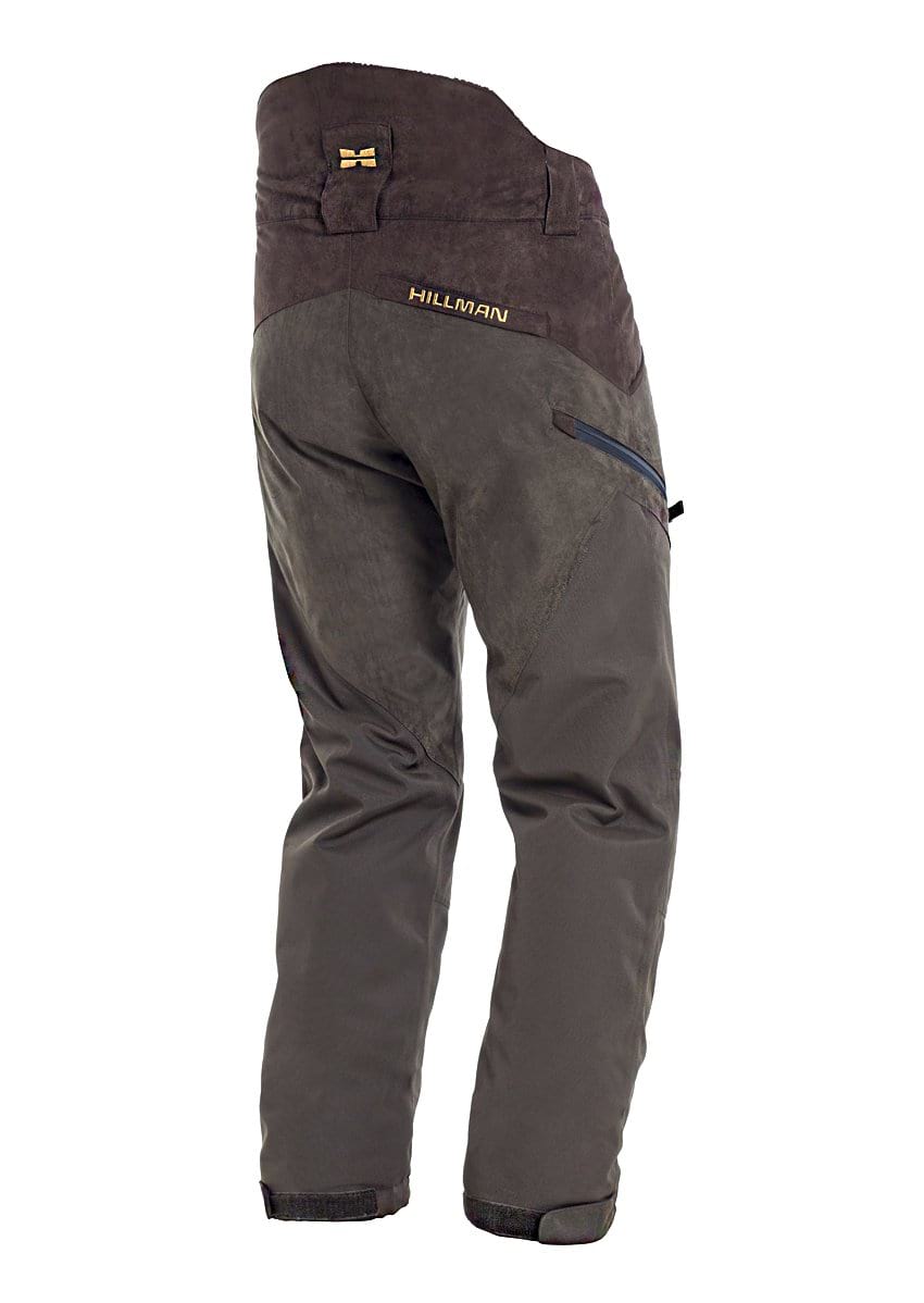 PRE ORDER Hillman® Fusion Waterproof Hunting Trousers in brown and dark gray, featuring a reinforced seat, black side zipper pocket, ergonomic fit, adjustable ankle straps, and Hillman® logo on the waistband. Shown from the back.