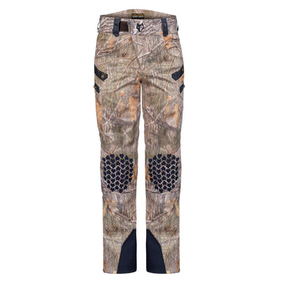 HILLMAN GEARs 6OL Matrix Insulated Hunting Trousers are camouflage pants with a tree and leaf pattern, reinforced knees with hexagonal designs, and multiple pockets. They offer optimal warmth in extreme cold and challenging conditions.