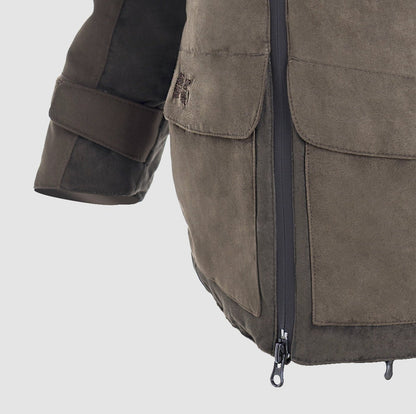 Close-up of the Hillman® PRE ORDER Fusion Hunting Jacket in brown suede Cordura, featuring a visible zipper, large front pocket, and adjustable sleeve strap against a light gray background.