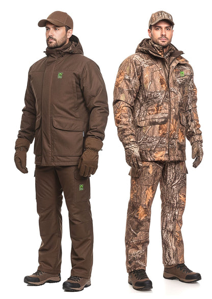 Two men stand side by side outdoors: one in a solid brown outfit, the other in the Winter Hunting Suit ARGO® 3 in 1 by Argo®, featuring a camouflage jacket, pants, and hood. Both wear gloves, caps, and sturdy shoes—great economy hunting gear.