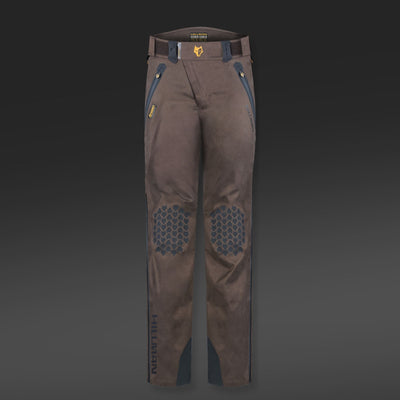 Brown and blue 5WL ultra-lightweight waterproof hunting trousers featuring reinforced knee patches with hexagonal patterns, set against a dark gradient background. The brand name HILLMAN GEAR is printed on the lower leg area.