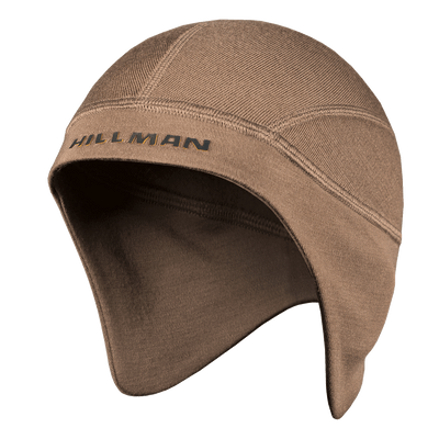 The Anatomic Merino Beanie [16μm] by Hillman® is a brown thermal hat with ear flaps, excellent insulation, and "HILLMAN" embroidered in black and yellow on the front, shown against a plain white background.