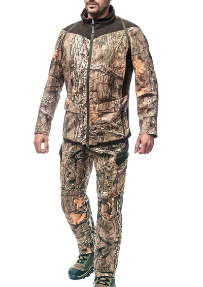 A figure wearing Hillman® XPR Silent Hunting Trousers | Camo stands against a white background. The woodland-patterned outfit and sturdy hiking boots imply stealthy navigation through rugged terrain, with their face obscured.